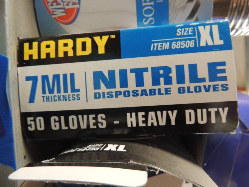 lot 717 image: 2 boxes of disposable gloves and lightbulbs