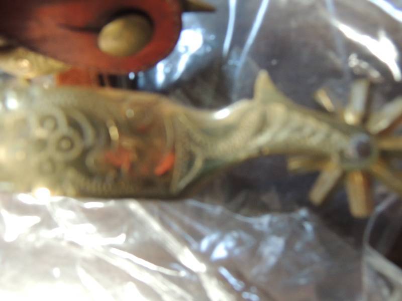 lot 734 image: Matching set Bronze lady leg spurs for men