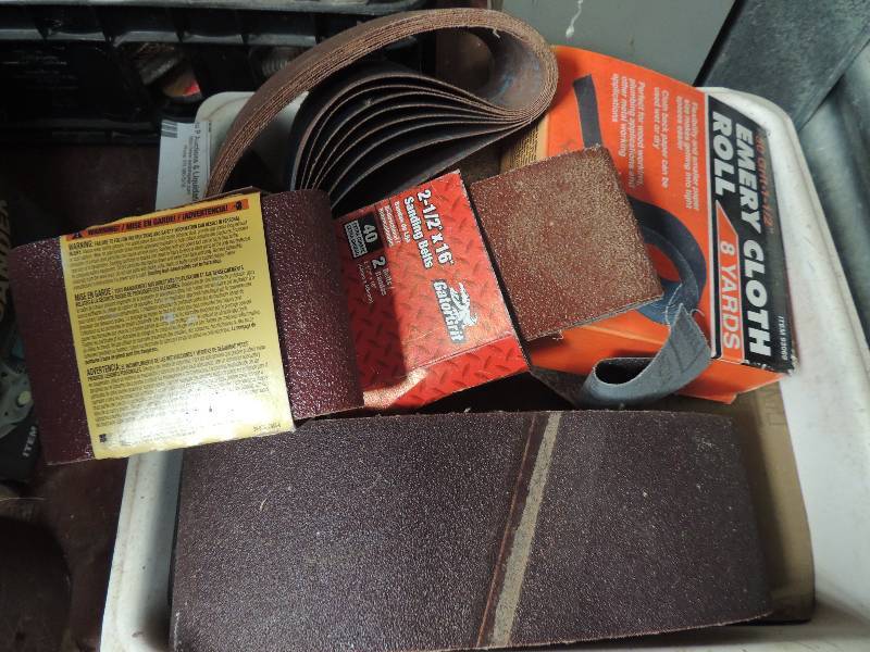 lot 9 image: red hand sander with sand paper