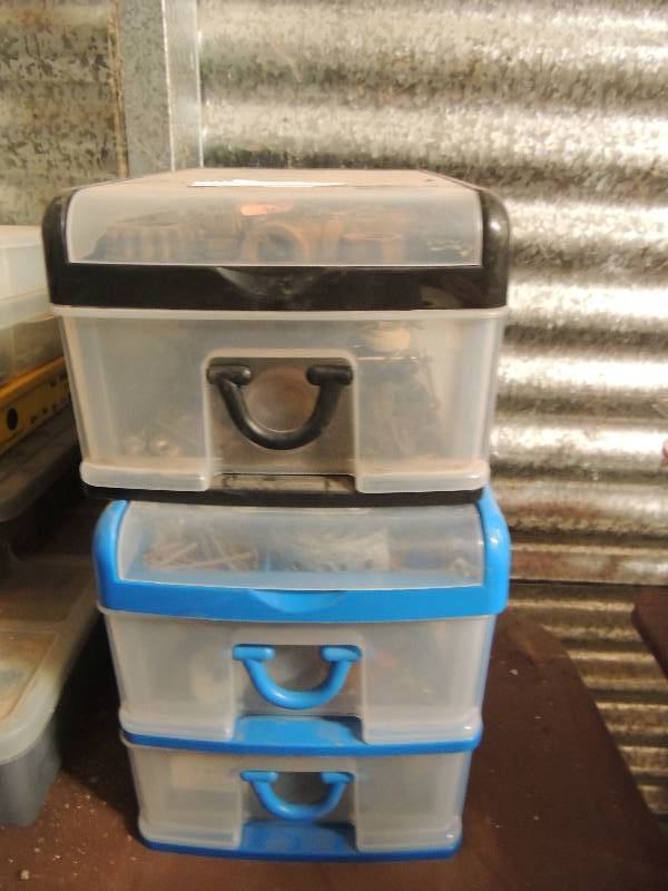 lot 20 image: Black 1 drawer with various bolts, screws, lugs and more ,assorted random tools and blue 2 drawer filled with same