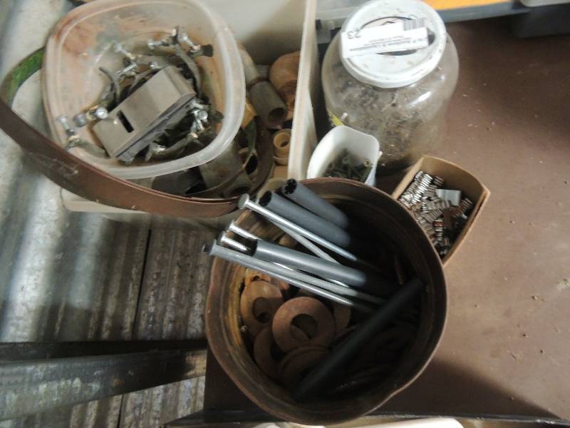 lot 23 image: Jar of nails, screws, and metal pipe fittings