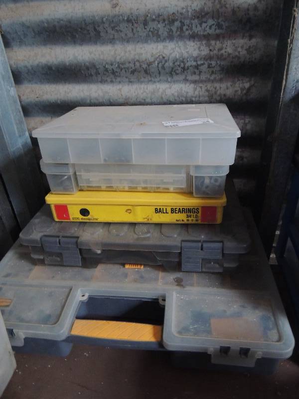 lot 24 image: 4 plastic tool boxes full of screws, clamps,nuts and bolts