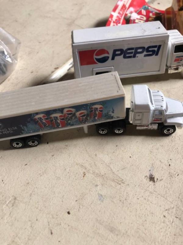 lot 803 image: 2 Pepsi truck,   one majorette - road eaters  Pepsi truck and car in package John Deere tractor and a Ford coup