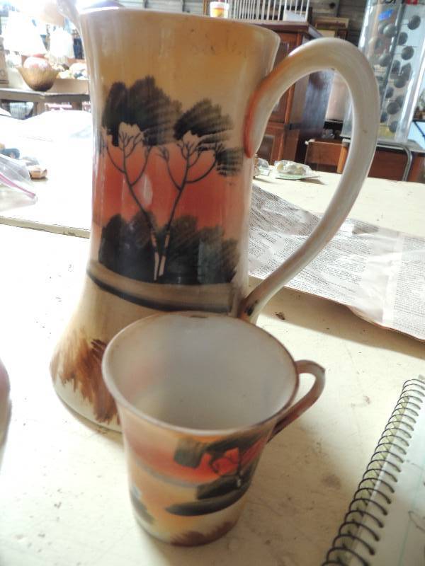 lot 392 image: Light brown pot, pink vase palm tree picture with one cup and stemmed vase