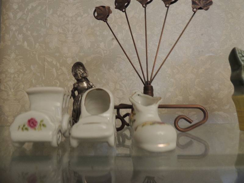 lot 31 image: metal letter holder and Boots, car buggy made in Taiwan