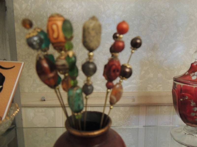 lot 37 image: Vintage HAT PINS - QTY 10  IN VASE