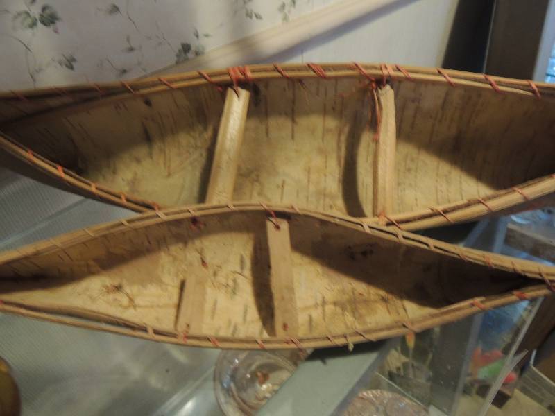 lot 121 image: 1 foot canoe and 18 inch canoe