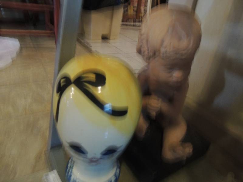 lot 131 image: Porcelain doll head for wigs