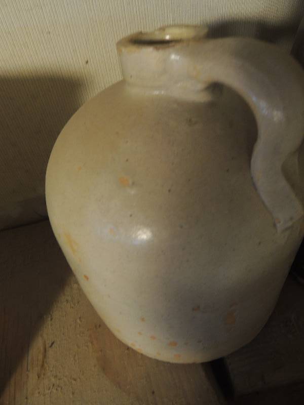 lot 168 image: 1 gallon jug cream 2 gallon jug brown