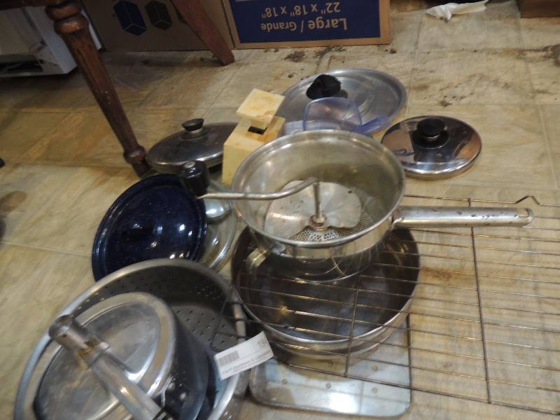 lot 194 image: Oven rack, pressure cooker, misc. pot lids, metal strainer