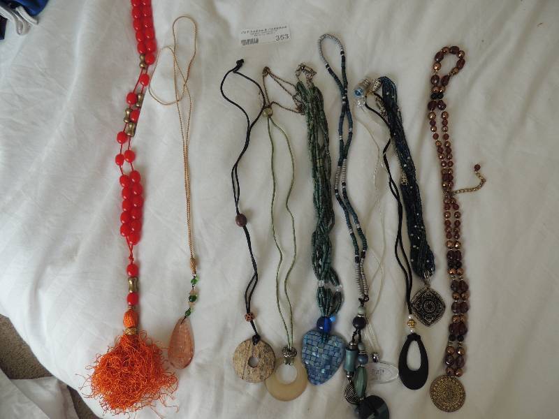 lot 353 image: Jewelry- 10 pieces Medallion necklaces  some on silk some on beads one lights up