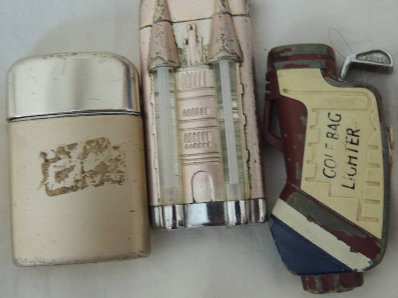 lot 363 image: Lighters- 3 pieces Ron son The Moon golf bag and castle design