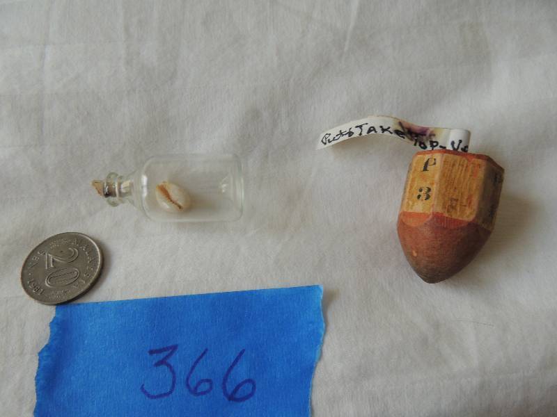 lot 366 image: 3 pieces shell in bottle, coin from Malaysia and Collectable vintage put and take top