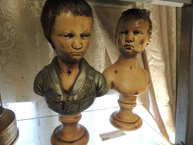 lot 11 image: 2 head statues of boy and girl