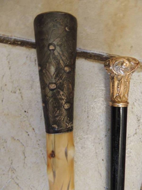 lot 103 image: 1wooden cane and 3 walking sticks