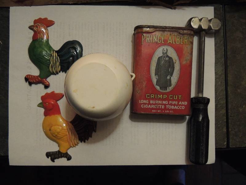 lot 459 image: Vintage Prince Albert tobacco can, small hammer,2 rooster magnets AND Graham Kerr Galloping gourmet citrus juicer