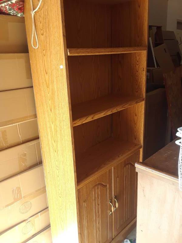 lot 109 image: WOOD BOOKCASE  WITH STORAGE AREA ON BOTTOM
