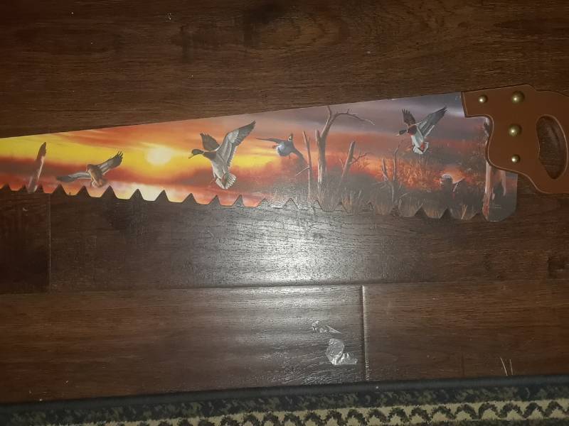 lot 60 image: WOOD SAW PAINTED WITH HUNTING SCENE