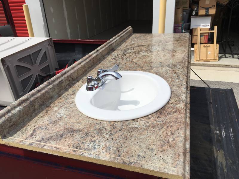 lot 71 image: BATHROOM COUNTER TOP WITH NEW SINK