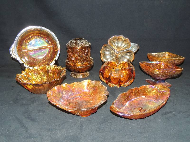 lot 196 image: Carnival glass Amber- Divided bowl, Covered candle holder, Candy dish x 2, oblong dish, Sunflower bowl. Leaf bowl x 2 art glass total of 9 pieces