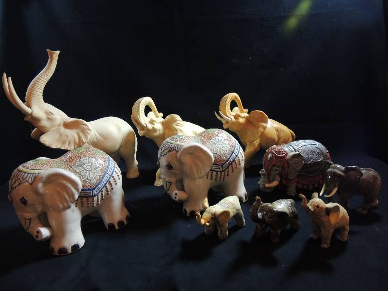 lot 202 image: Elephants. Do you like Pacaderms Well here is your dream come true. Porcelain 5 by Goebel, white alabaster by Giannella one is 15, 3 from phillipines Ceramic with BLANKETS  10 total