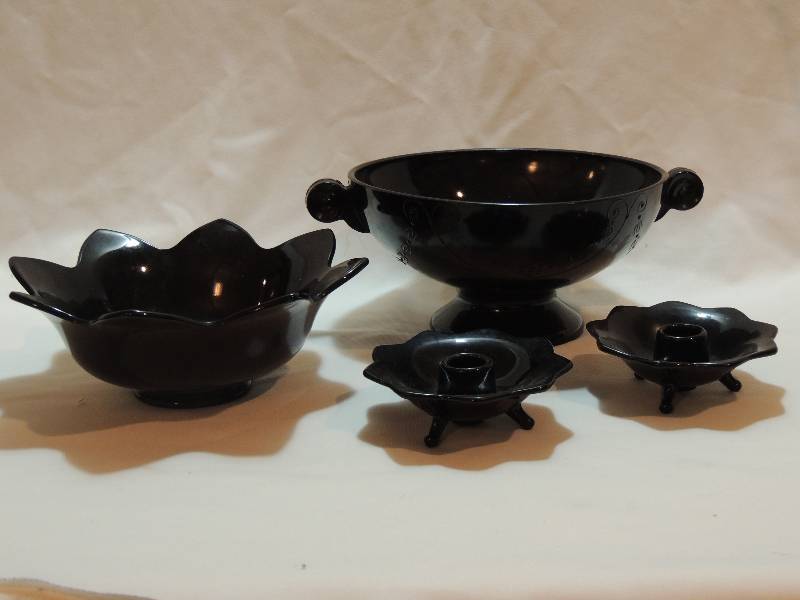 lot 7 image: Fenton- Dark Purple 2 handled bowl 11. Black Sunflower Bowl and pair black Candle sticks