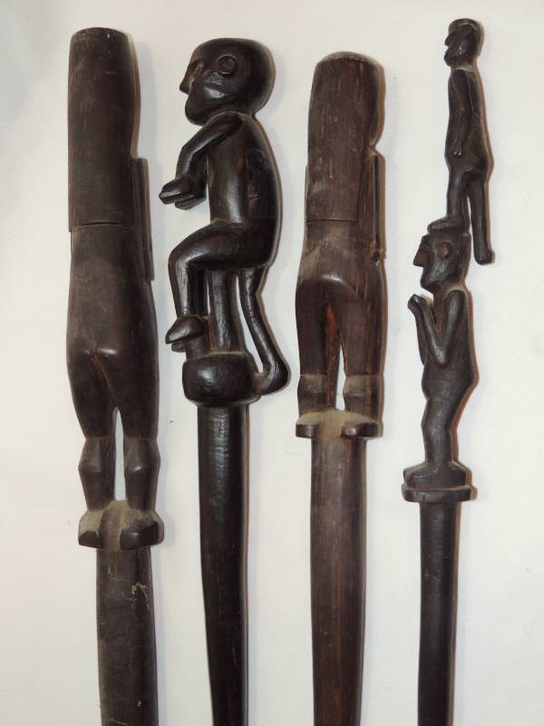 lot 182 image: African carved  tribal -  4 different tribal CARVINGS, HUMANS  On dark wood    1 IS 25,   3 ARE 16