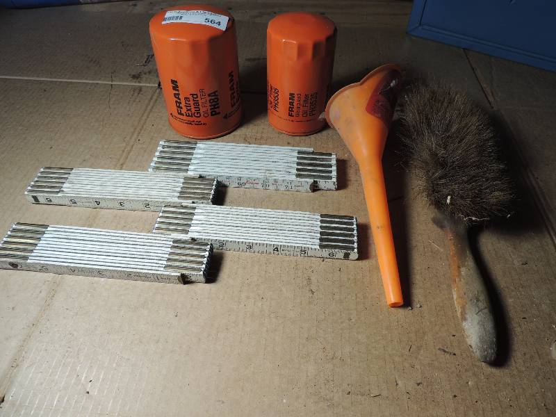 lot 564 image: 2 new FRAM oil filters, 4 yard sticks, Funnel, dust brush