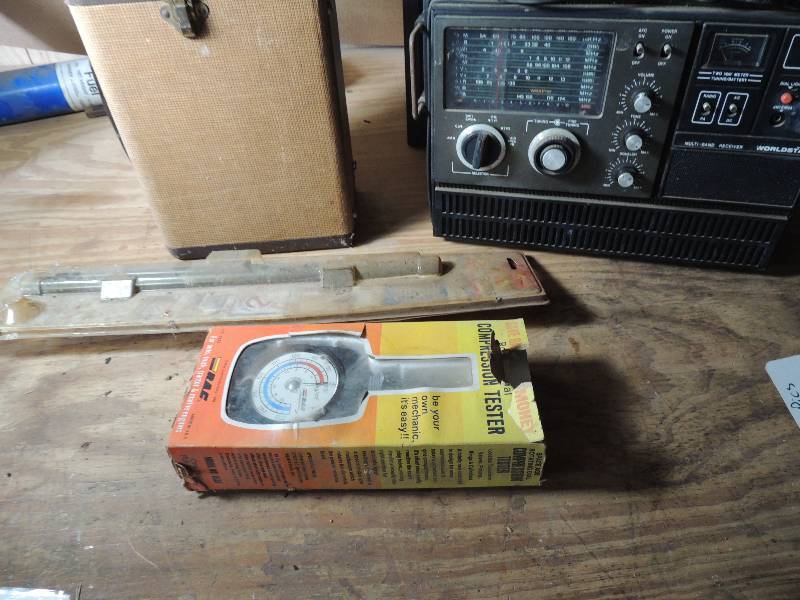 lot 591 image: Empty mini case, FM TV Radio (unknown working condition, Compression tester, Car window shade