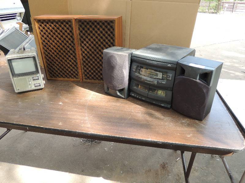 lot 611 image: Wooden stereo speakers Sharp cassette tape player Radio of unknown working status and Retro TMK Television AC.DC battery Minn Rota trlling mote