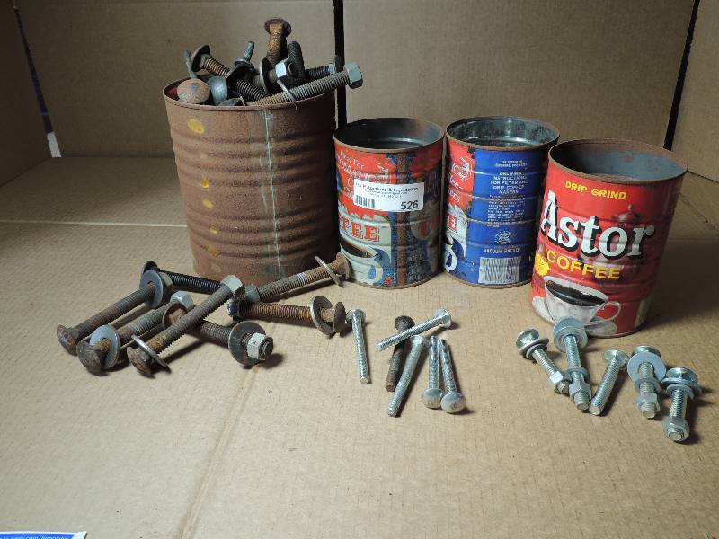 lot 526 image: 1 Large and 3 small cans of bolts with nuts and washers several sizes
