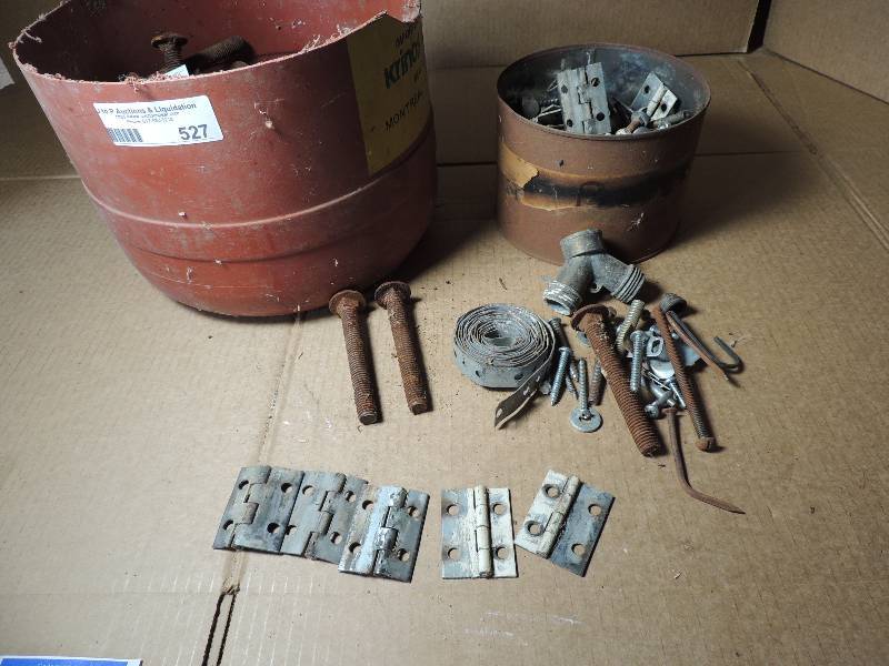 lot 527 image: Small red tub full of large bolts, various screws, door hinges and more.