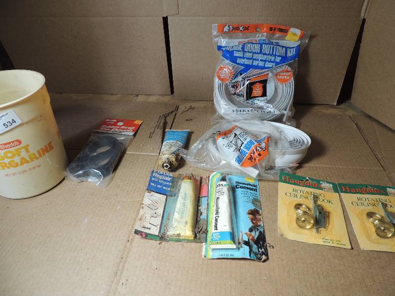 lot 534 image: NIB Garage Door button kit, rotary ceiling hooks, household cement and much more