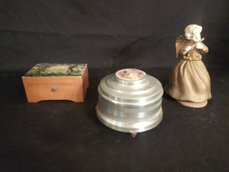 lot 34 image: Music Boxes- Dixie Landing wooden, Round metal  Victorian picture, Angel playing flute