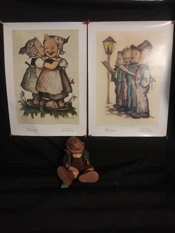 lot 51 image: Hummel- 2 prints and one doll in need of hospitalization (needs TLC) has tragic facial collapse