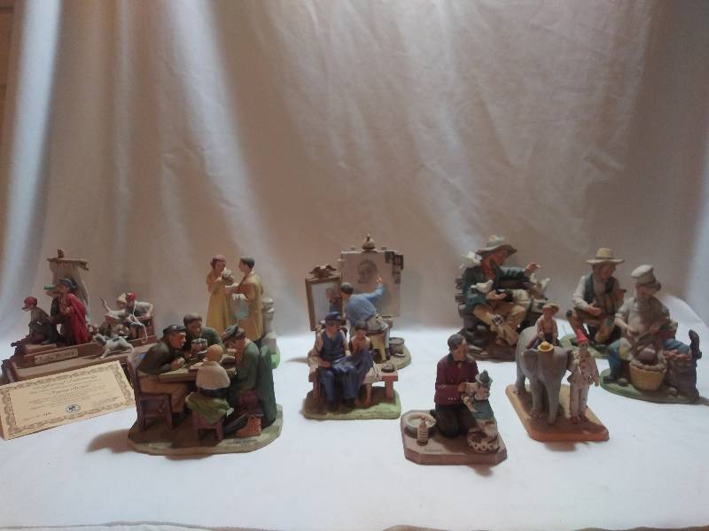 lot 62 image: Norman Rockwell figurines- The Circus comes to town, Self portrait, While the audience waits, The lighthouse keepers daughter, The first prom, Grace before meals and Gorham China Jolly Rodger