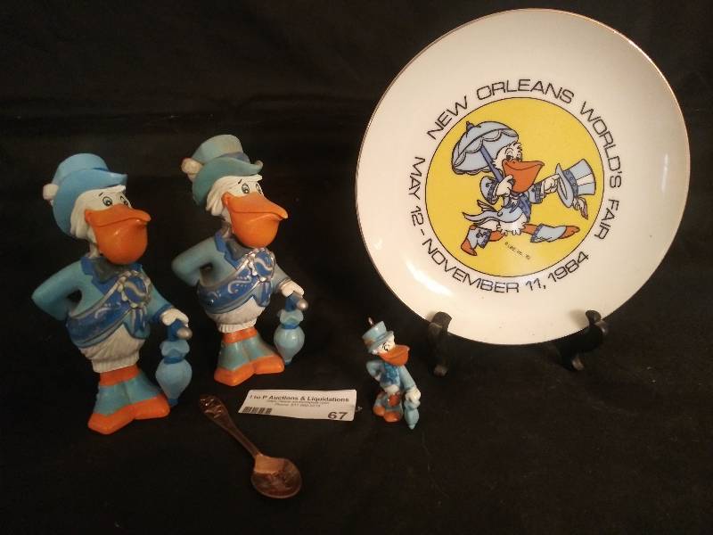 lot 67 image: New Orleans Worlds Fair May 12- November 11, 1984, Mascot of Worlds fair Pelican Figurines Seymour 6 x 2 and Plate and collector spoon