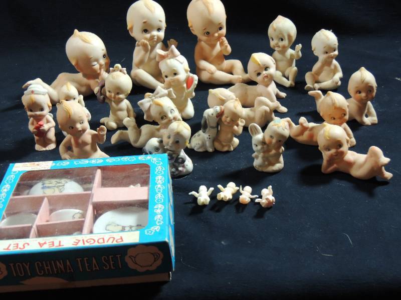 lot 213 image: Kewpie Dolls several including Some that Lefton qty 16 Kewpies Pudgie toy tea set in box Complete