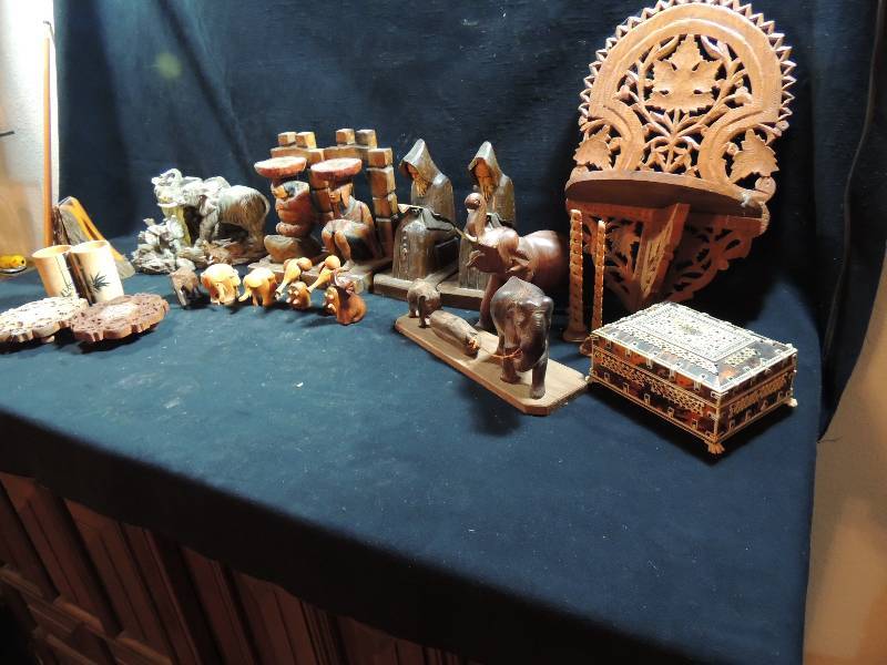 lot 219 image: Assortment of bookends,  jewelry box, trivet elephant x 7 wood carved and elephant totems