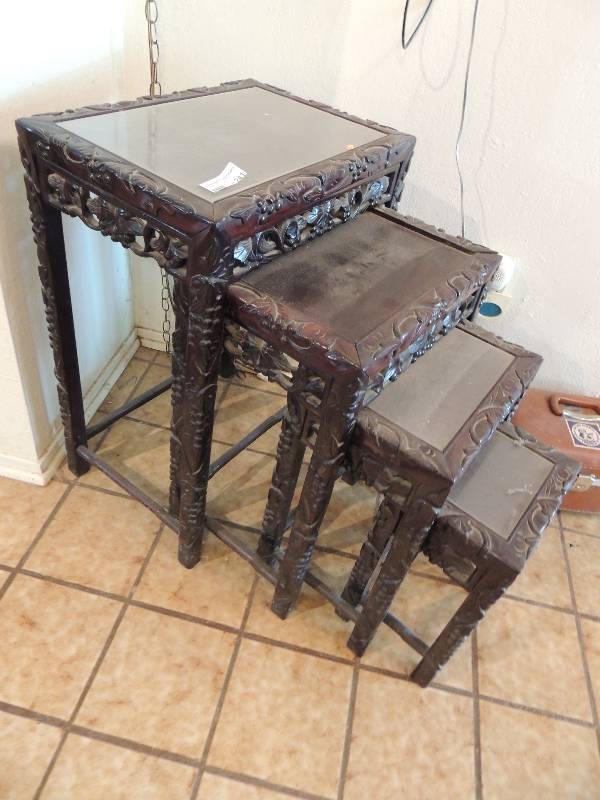 lot 241 image: Carved nesting tables set of 4 grape and leaf motif glass top inserts 29 x 19 x 14, 23 x 16 x 12, 19 x 13 x 10, 15 x 10 x 8.