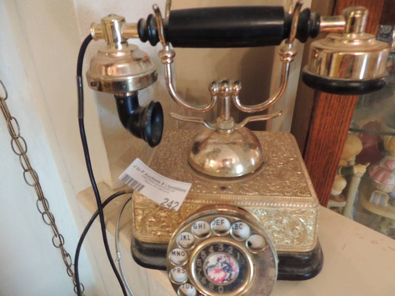 lot 242 image: Parisian phone rotary dial gold, Bakelite receiver, couple converted to use in USA
