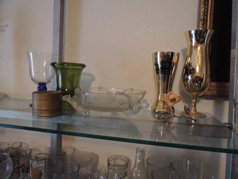 lot 253 image: Beaded necklaces glass bowl with birds, 2 jewelry glass boxes, paperweight, mugs and glasses.