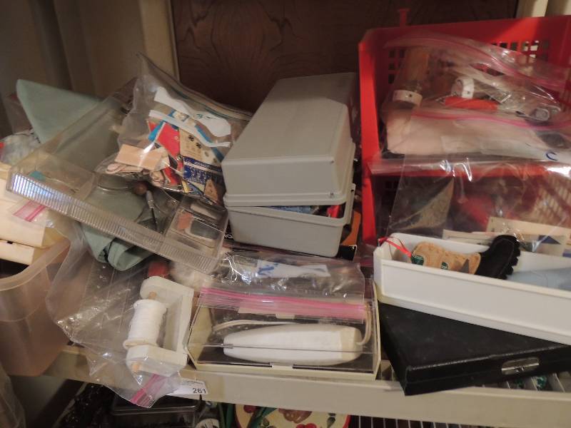 lot 261 image: Sewing lot- needles, thread, scissors, rotary cutters, electric scissors, trays, bobbins and more