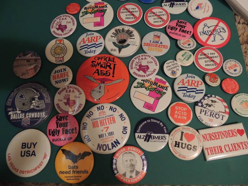 lot 263 image: Various buttons ( pin back) Ross Perot, Nurse finders, Cowboys, Hugs, Ostrich and more