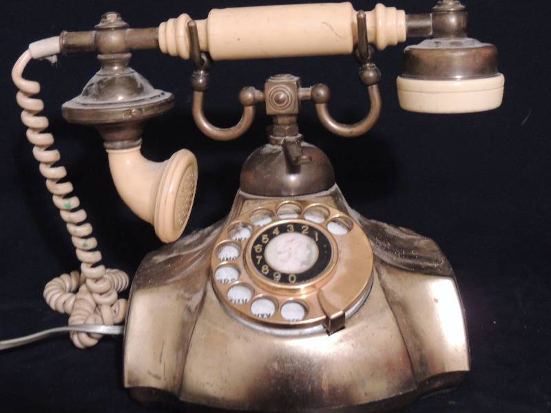 lot 268 image: Brass Rotary telephone - Bakelite receiver  date 670    Model name  The Electra Japan