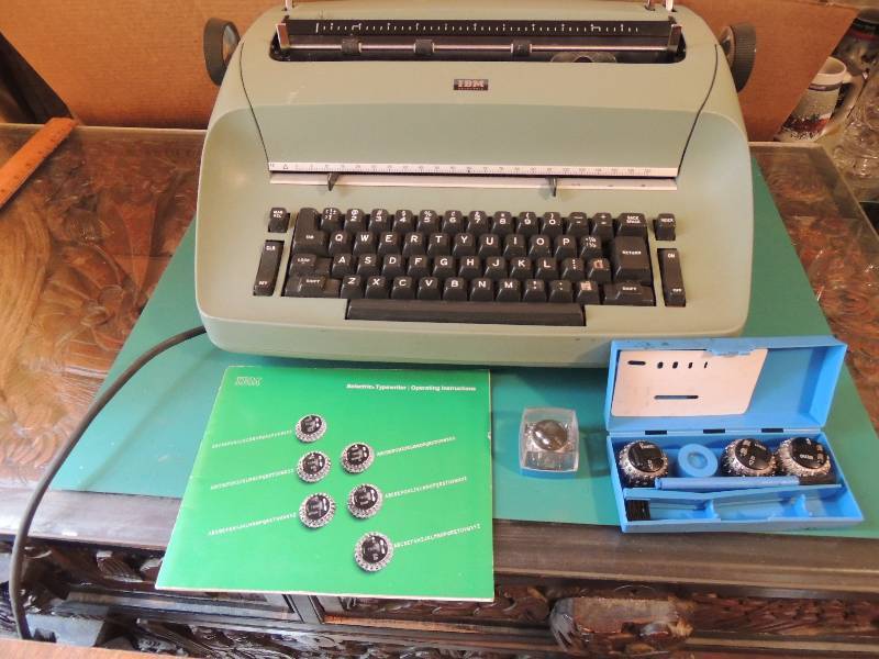 lot 270 image: IBM Selectric typewriter comes with manual cover and 4 font balls. Go old school