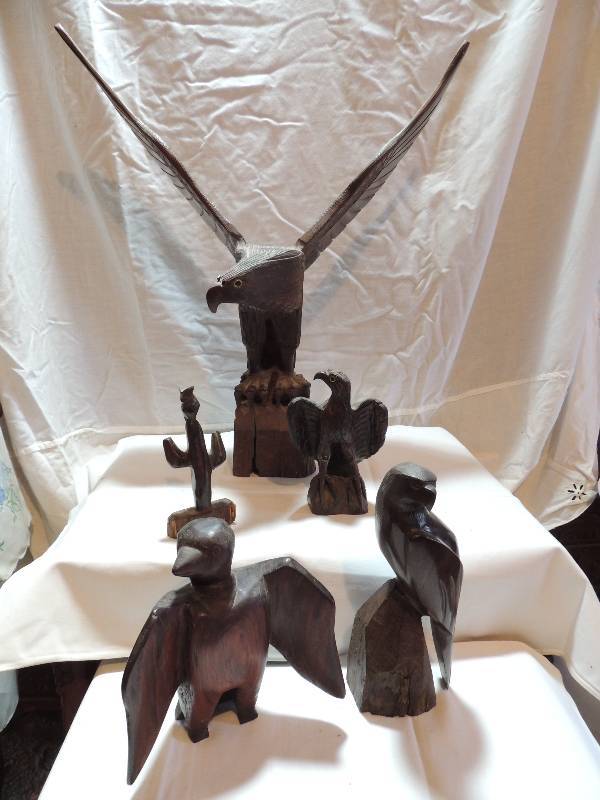 lot 303 image: Ironwood carvings- Eagle -21 X 19W X9 , Mayan bird 8H, Hawk - 9 X 7, Owl on cactus 7, Hawk - 7