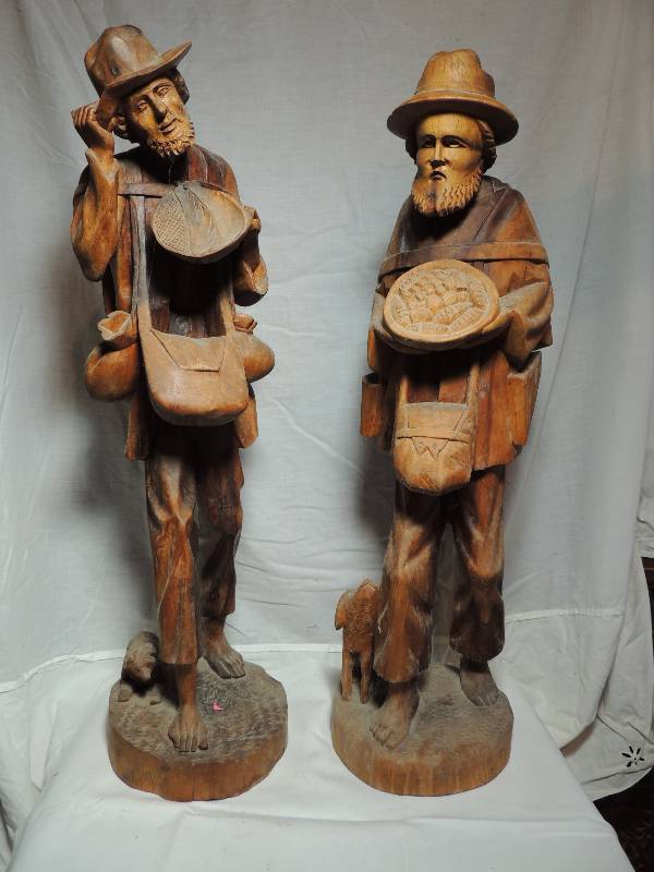 lot 515 image: Carved wood  Man with harvest of vegetables  27H  and Man with wood tray, basket & dog  HT 27   Qty 2