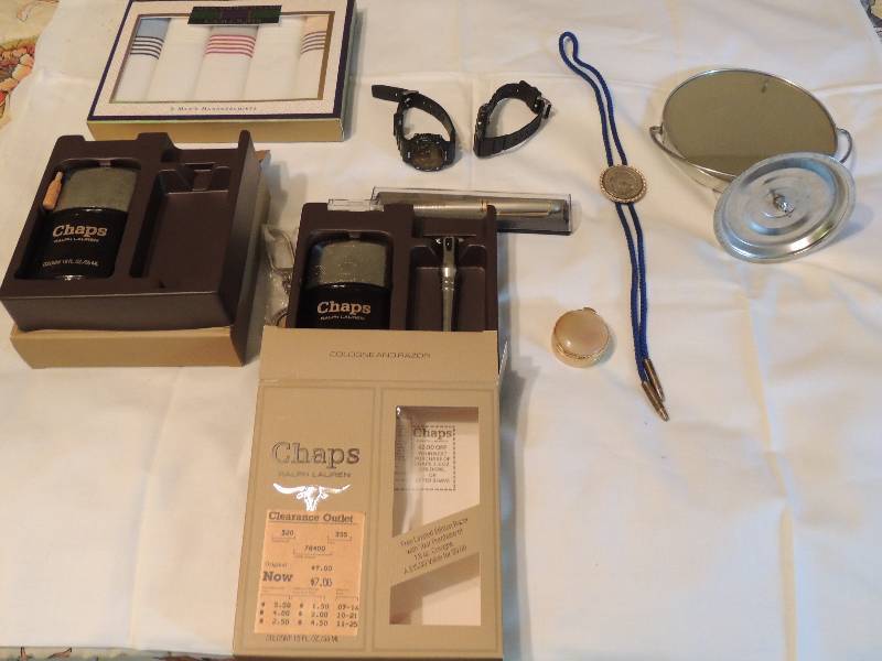 lot 319 image: Make up mirror, Chaps cologne, Bolo tie, pill box, new handkerchiefs. Everything you need to go out and party.