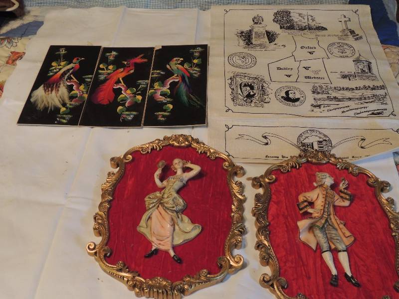 lot 320 image: Art- Feather art of birds on black qty. 3  (11 X5) Victoria plaques male and female Italy  (13 X10) and wall hanging of England from 5 cent bank